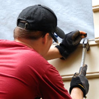 Huff's Construction - a man fixing a window - Gutter Services Near Me - Williamsport, Ohio Huff's Construction - a man fixing a window - Gutter Services Near Me - Williamsport, Ohio
