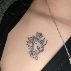 White Wizard Tat-2 & Body Piercing - Some lines are missing if you can't tell.