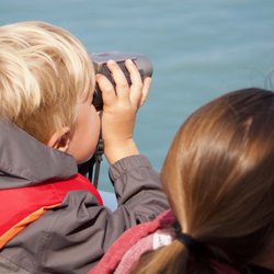 Seaman's Ecotour Adventures - Mom and son check out otters close to boat