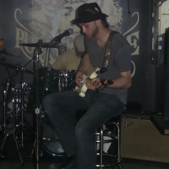 727 Club - a man playing guitar on stage - Sports Bars Near Me - Tulsa, Oklahoma 727 Club - a man playing guitar on stage - Sports Bars Near Me - Tulsa, Oklahoma