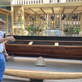 Mauna Lani  Auberge Collection - "Uncle" Danny leading a Native Plant Tour and explaining the history of the traditional canoe displayed in the resort lobby - Resorts Near Me - Waimea, Hawaii