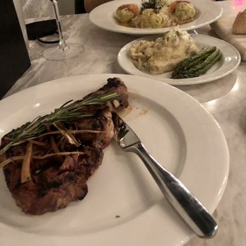 Taproot Tavern - Hawaiian ginger marinade rib eye, garlic mashed potatoes, asparagus, crab stuffed shrimp with risotto. - Steakhouses Near Me - Farmville, Virginia