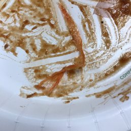 a paper plate with food on it