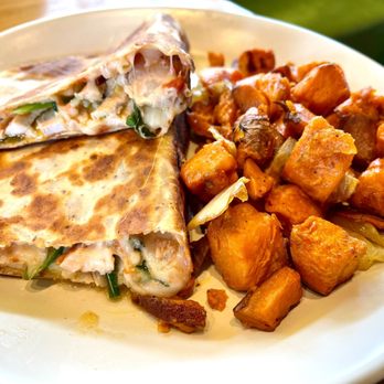 True Food Kitchen - Chicken wrap with a side of sweet potato hash. - New American Near Me - El Segundo, California True Food Kitchen - Chicken wrap with a side of sweet potato hash. - New American Near Me - El Segundo, California
