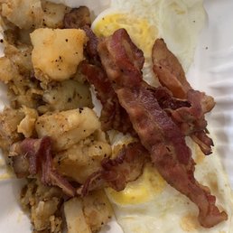 bacon and potatoes on a paper plate