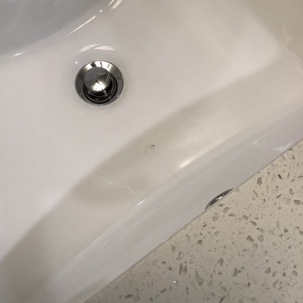 Two99 Monroe - Cracked bathroom sink - Apartments Near Me - Roanoke, Texas