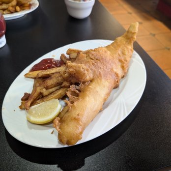The Codfather - That is a huge piece of haddock. The fries are crispy and the fish was cooked perfectly - Fish & Chips Near Me - Henderson, Nevada