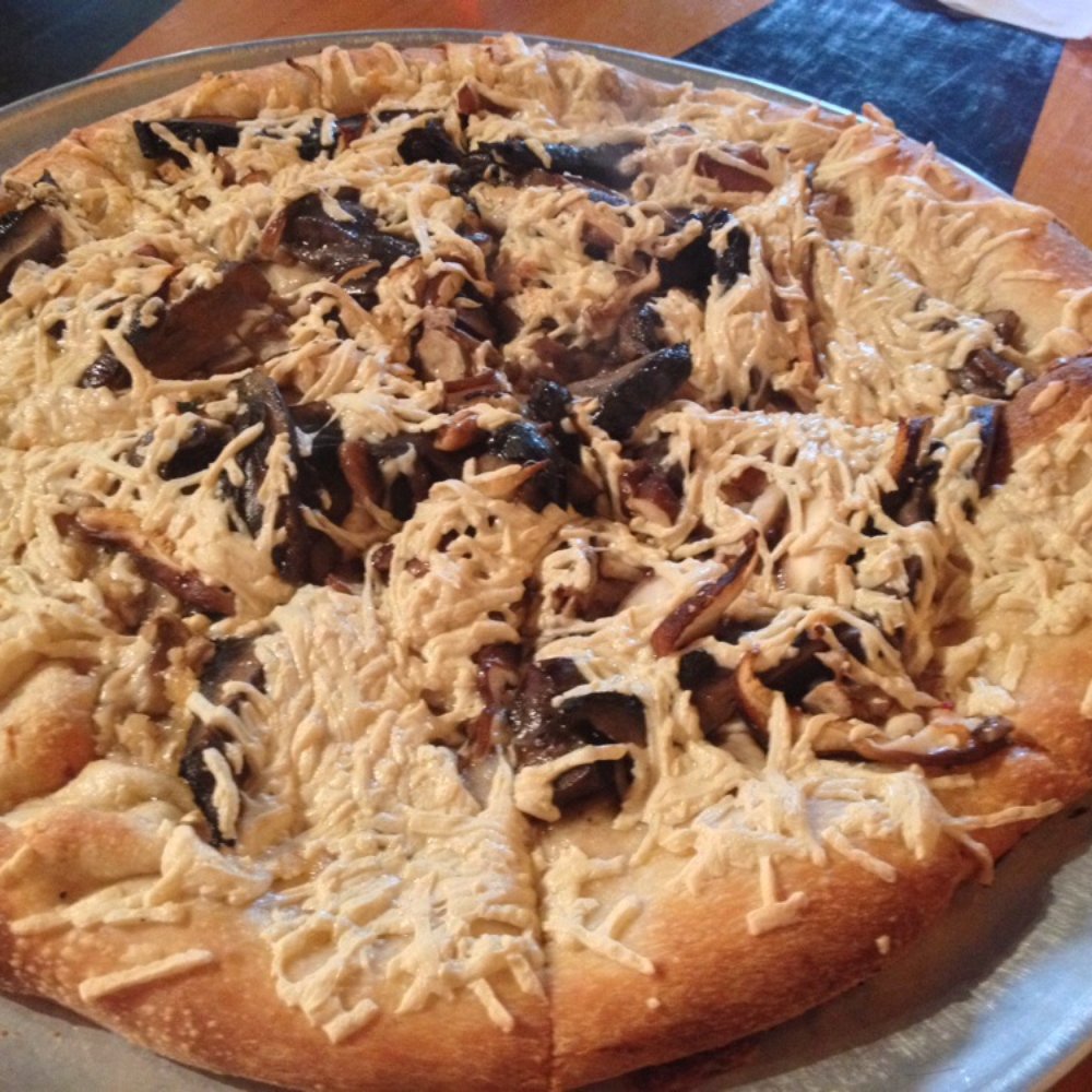 Lilly's Pizza - The Gus with vegan cheese. Holy delicious mushrooms. - Pizza Near Me - Raleigh, North Carolina Lilly's Pizza - The Gus with vegan cheese. Holy delicious mushrooms. - Pizza Near Me - Raleigh, North Carolina