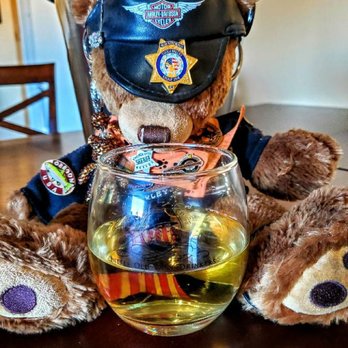 Little Old Wine Drinkers Winery - Rodie D. Bear enjoying a glass of pinot - Wineries Near Me - Kingman, Arizona Little Old Wine Drinkers Winery - Rodie D. Bear enjoying a glass of pinot - Wineries Near Me - Kingman, Arizona