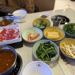 The Spot Rotary Hot Pot - Tom yum brother with variety of vegetables.