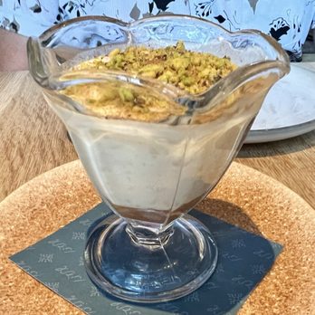Ladino - Sutlaç- Turkish rice pudding topped with crushed pistachios - Mediterranean Near Me - San Antonio, Texas