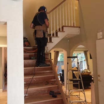 California Fine Stairbuilding - a man standing on a set of stairs - General Contractors Near Me - Mountain View, California