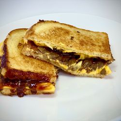 Grilled Cheese and Boba Teas - Grass-fed, locally sourced, smoked brisket, sharp cheddar cheese, BBQ sauce, on sourdough-grilled with ghee. $13