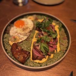 ARROZ CON PATO duck breast, confit leg, cilantro-beer rice, duck egg, huancaina add pan seared foie gras - $24
