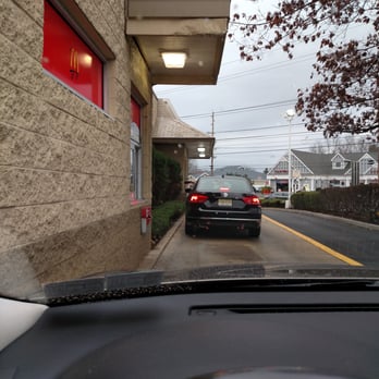 McDonald's - a car driving down a street - Fast Food Near Me - Mount Holly, New Jersey McDonald's - a car driving down a street - Fast Food Near Me - Mount Holly, New Jersey