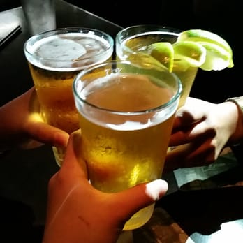 Yard House - Cheers! Left to right: Stella, Kirin, Budlight with lime. - New American Near Me - Honolulu, Hawaii Yard House - Cheers! Left to right: Stella, Kirin, Budlight with lime. - New American Near Me - Honolulu, Hawaii