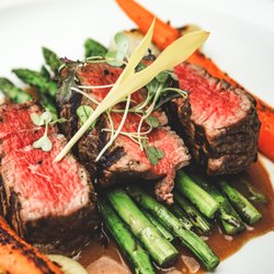 Coop 303 - Chargrilled Fillet Mignon, with marinated grilled asparagus, roasted baby carrots, sous-vide cippolini onions, and roasted garlic.