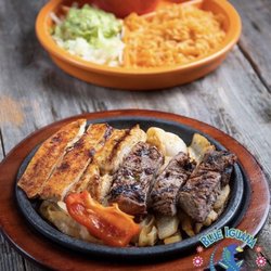 A sizzling combination of tender grilled steak and juicy chicken served over sautéed onions and peppers with authentic Tex-Mex flavor.