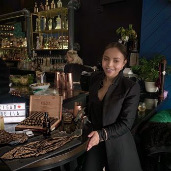 Cigar Master Roller-Las Vegas - a woman at a bar - Party & Event Planning Near Me - Las Vegas, Nevada Cigar Master Roller-Las Vegas - a woman at a bar - Party & Event Planning Near Me - Las Vegas, Nevada
