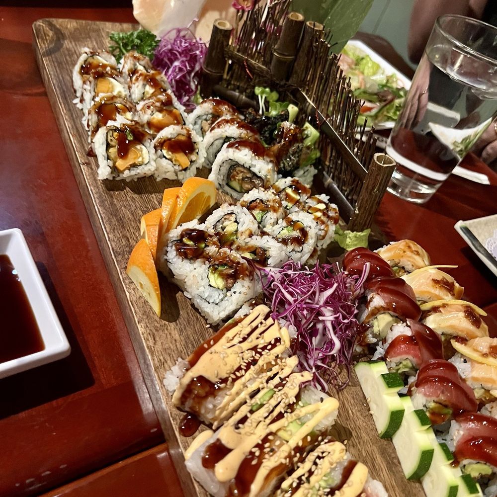 Red Ginger - a variety of sushi on a wooden platter - Sushi Bars Near Me - Denver, Colorado Red Ginger - a variety of sushi on a wooden platter - Sushi Bars Near Me - Denver, Colorado