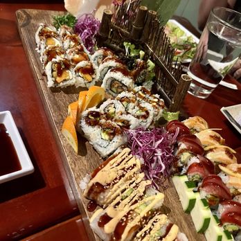 Red Ginger - a variety of sushi on a wooden platter - Sushi Bars Near Me - Denver, Colorado Red Ginger - a variety of sushi on a wooden platter - Sushi Bars Near Me - Denver, Colorado