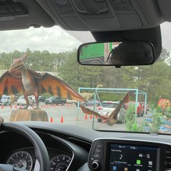 Dinosaur Drive-Thru - Dinosaurs and cars.