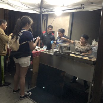 Taquizas Maria - a group of people at a food stand - Tacos Near Me - San Diego, California Taquizas Maria - a group of people at a food stand - Tacos Near Me - San Diego, California
