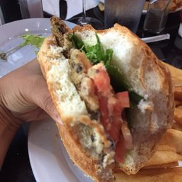 Inside of the vegetarian quinoa burger. Bun, burger, cheese, lettuce. They forgot the grilled onions. No sauce. Not worth it. Inside of the vegetarian quinoa burger. Bun, burger, cheese, lettuce. They forgot the grilled onions. No sauce. Not worth it.