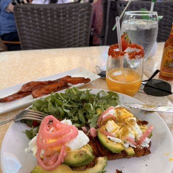 Brunch 101 - Avo (GF) Toast, side of Peppered Bacon and what's left of the Frozen Mango Mimosa - Breakfast & Brunch Near Me - Cathedral City, California Brunch 101 - Avo (GF) Toast, side of Peppered Bacon and what's left of the Frozen Mango Mimosa - Breakfast & Brunch Near Me - Cathedral City, California