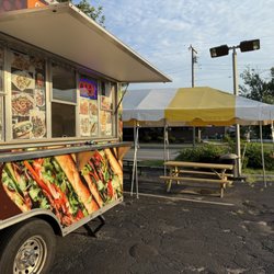 Rick's Banh Mi & More - 2 shaded picnic tables nearby