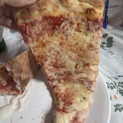 It's not a great picture because I was hungry, but this is what the pizza look like. It was just cheese, but it has nice flavor in it.