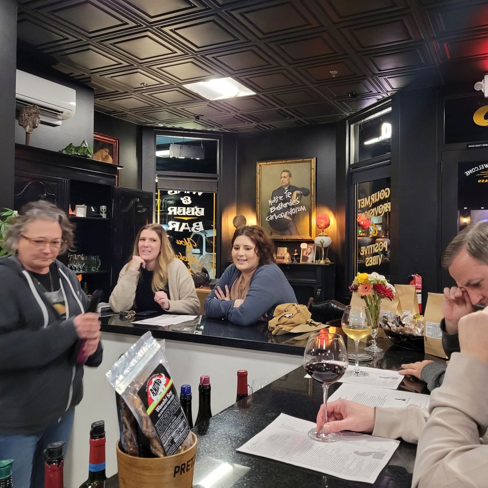 Lark & Sparrow - a group of people sitting at a bar - Wine Bars Near Me - Orcutt, California