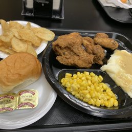 Fried chicken, mashed potatoes, corn, fresh natural potato chips, bread and butter. Fried chicken, mashed potatoes, corn, fresh natural potato chips, bread and butter.
