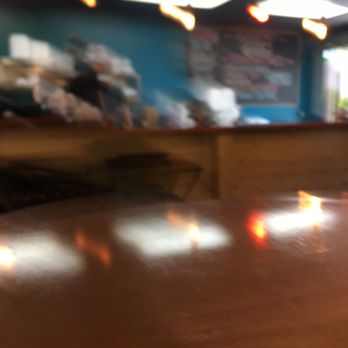 Meats & Mooore - a blurry image of a table - Meat Shops Near Me - Bay City, Michigan Meats & Mooore - a blurry image of a table - Meat Shops Near Me - Bay City, Michigan