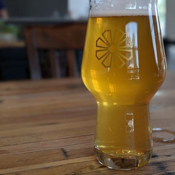 Peculier Ales - a glass of beer on a table - Breweries Near Me - Windsor, Colorado