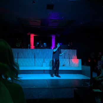 Bad Boys Live - a man standing on a stage - Strip Clubs Near Me - Chicago, Illinois