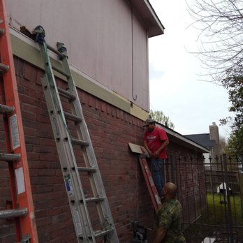 Reynaldo Remodeling - two men on a ladder - General Contractors Near Me Reynaldo Remodeling - two men on a ladder - General Contractors Near Me