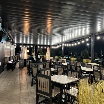 Gator’s Dockside - O Town West - Outdoor patio seating at night is so fun - Sandwiches Near Me - Orlando, Florida