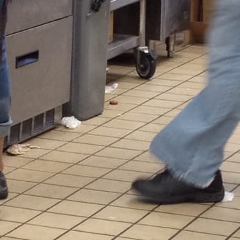 Dunkin' -  a person walking in a kitchen - Donuts Near Me - Orange Park, Florida