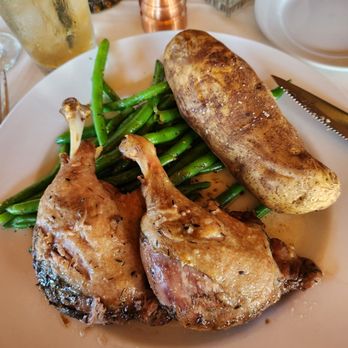 Copper Dock Restaurant - Duck confit includes baked potato with green beans. - New American Near Me - Hubertus, Wisconsin