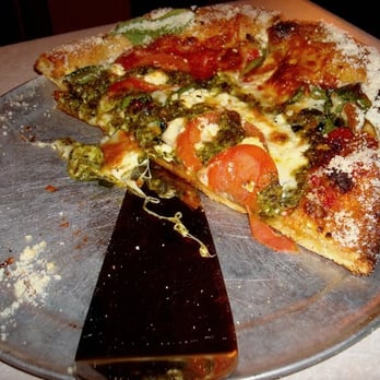 Mellow Mushroom Charlottesville - the "Kosmic Karma pizza: sun-dried tomatoes, spinach, feta, fresh tomatoes and kosmic swirls of pesto." individual pizza - Pizza Near Me - Charlottesville, Virginia