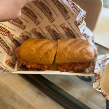 Firehouse Subs - a hand holding a sandwich - Fast Food Near Me - Waterville, Maine Firehouse Subs - a hand holding a sandwich - Fast Food Near Me - Waterville, Maine