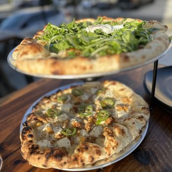 Homeslice - The Sasha on top, super zesty, refreshing, and flavors perfection! The Delacroix on the bottom, the mix is so good! - Italian Near Me - Dana Point, California