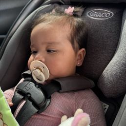 Baby 10 minutes after ear piercing. They're not red and she's totally fine!