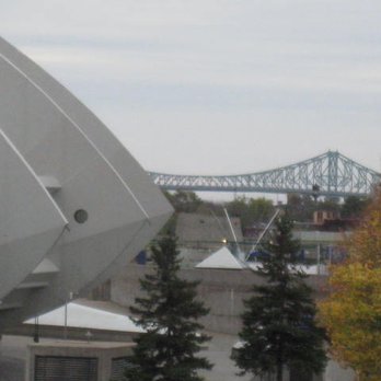 Parc Olympique de Montréal - The Pont Jacques-Cartier in the background with the concrete fins of the Olympic Stadium to the left. - Landmarks & Historical Buildings Near Me - Montreal, Quebec Parc Olympique de Montréal - The Pont Jacques-Cartier in the background with the concrete fins of the Olympic Stadium to the left. - Landmarks & Historical Buildings Near Me - Montreal, Quebec