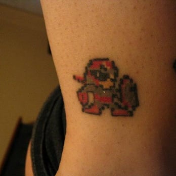 China Doll Tattoo & Piercing - Protoman by Jim - Tattoo Near Me - Hammond, Indiana