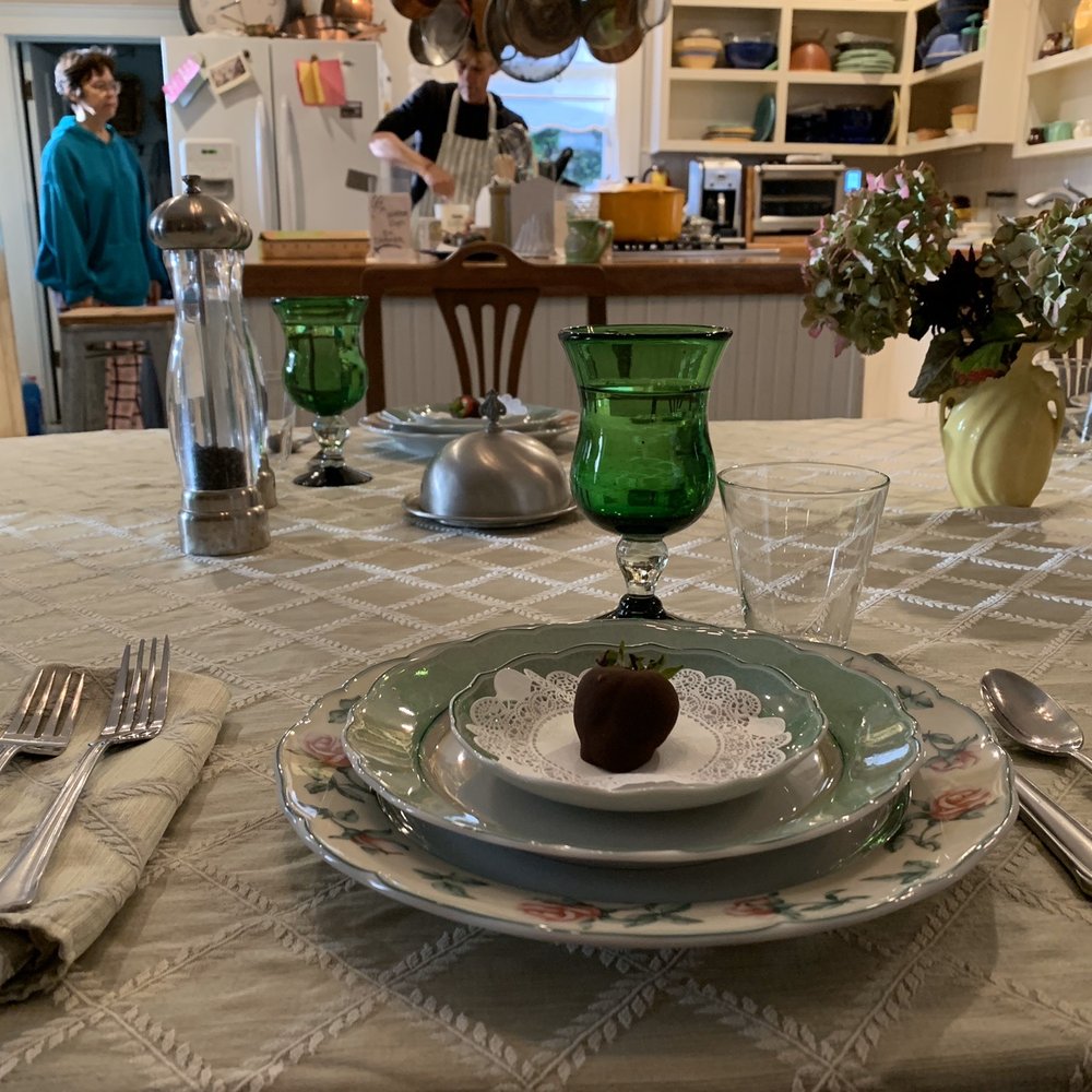Clementine's Guest House - Chocolate dipped strawberry to start. Yvonne and Steven are in the background cooking our breakfast. - Guest Houses Near Me - Astoria, Oregon Clementine's Guest House - Chocolate dipped strawberry to start. Yvonne and Steven are in the background cooking our breakfast. - Guest Houses Near Me - Astoria, Oregon