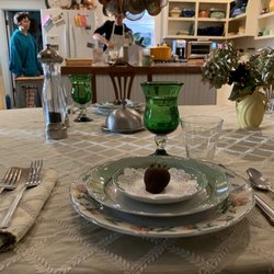 Clementine's Guest House - Chocolate dipped strawberry to start. Yvonne and Steven are in the background cooking our breakfast.