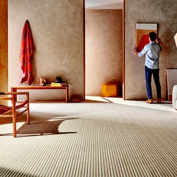 Flooring Expo by Carpet King - a man standing in a living room - Carpeting Near Me - Eagan, Minnesota