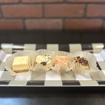 Ultimate Cheesecake - a variety of cheesecakes on a checkered plate - Bakeries Near Me - Corpus Christi, Texas Ultimate Cheesecake - a variety of cheesecakes on a checkered plate - Bakeries Near Me - Corpus Christi, Texas
